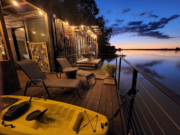 the waterfront balcony at The Cube on the Murray River, SA at sunset