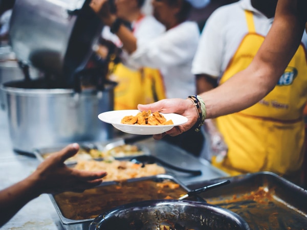 Volunteer to feed the homeless