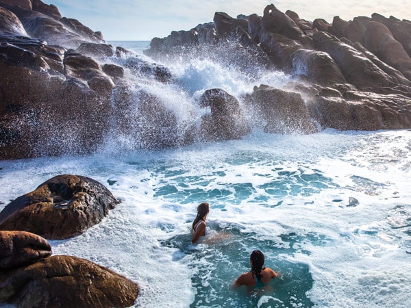 two people enjoying a dip at Injidup Natural Spa/Wyadup Rocks, Margaret River, WA