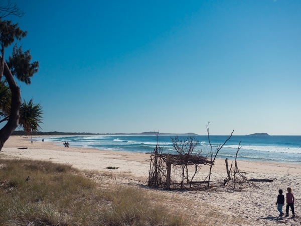 kids enjoying a walk along Kingscliff Beach