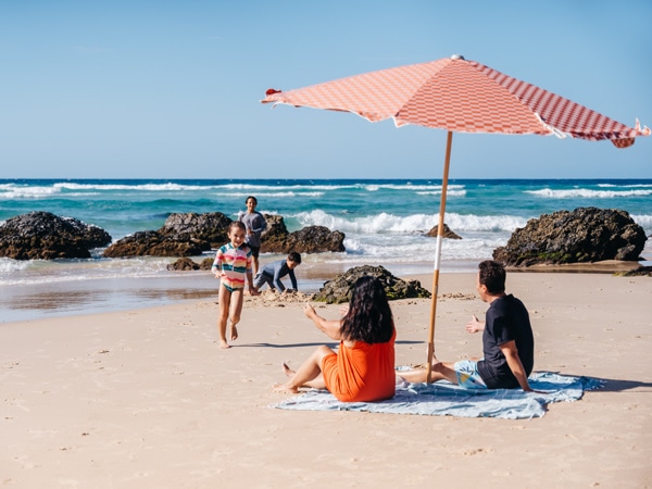 a family bonding at Kirra Beach, Qld