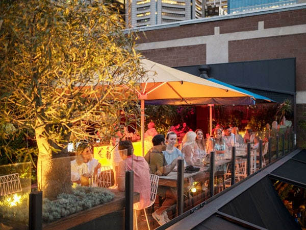 the Loop Roof filled with people at night