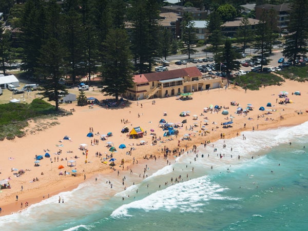 Crowds on the sand at Newport Beach in northern beaches of Sydney