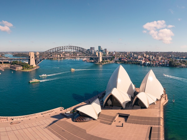 an aerial view of the SydneyOpera House and the Sydney Harbour Bridge