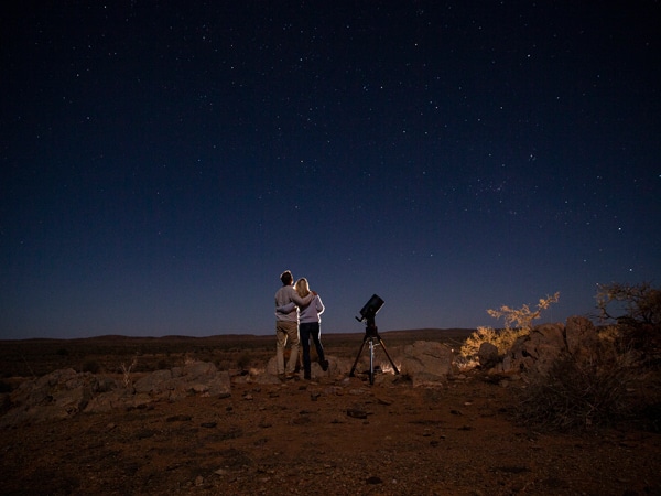 a couple stargazing at Outback Astronomy, Broken Hill, NSW