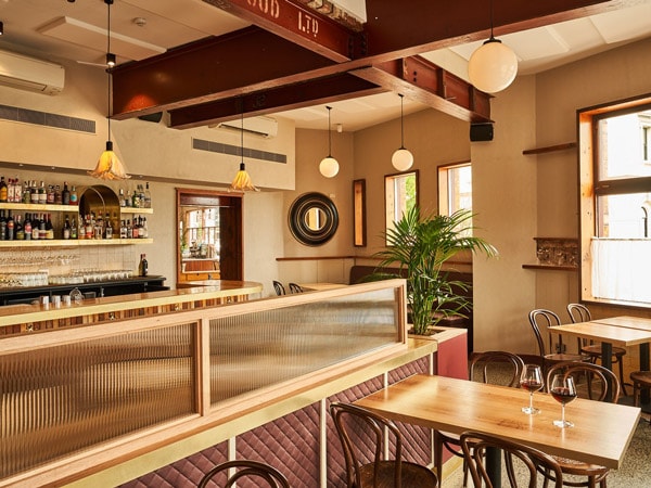 the dining interior of Post Office Club Hotel