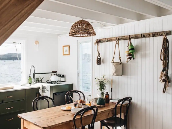 the dining area inside The Salty Dog houseboat in Newport, Sydney, Australia