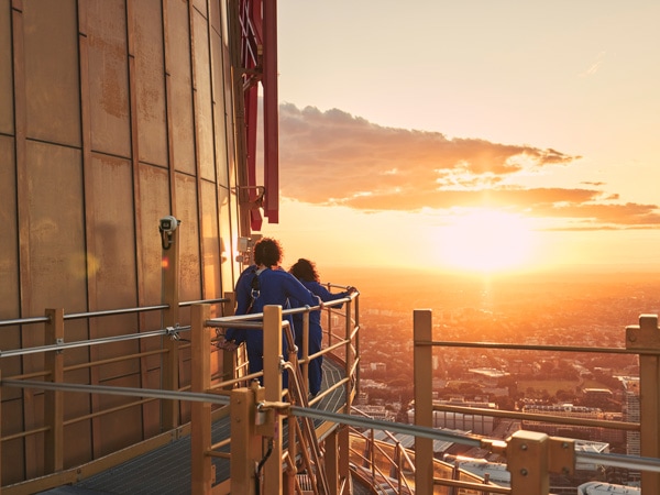 a family enjoying the Sydney Sky Tower Skywalk at sunset