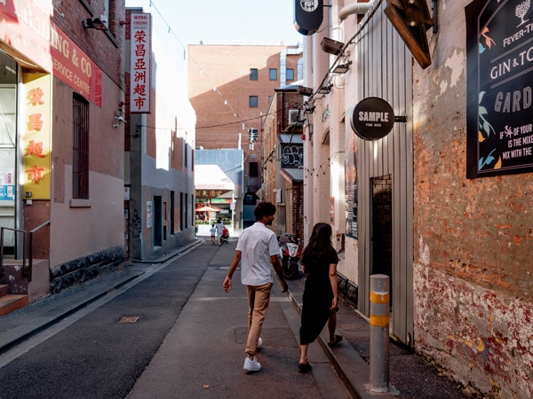 a couple entering Union Electric Bar, CBD