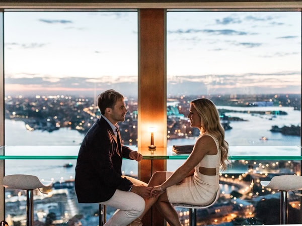 a couple sitting face to face at Blu Bar on 36, The Rocks, Sydney