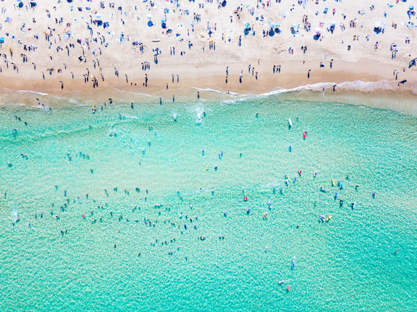 an aerial view of the crowded Bondi Beach