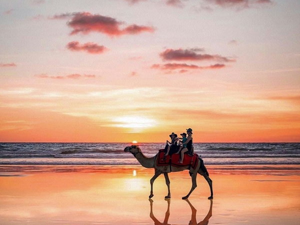 riding a camel at sunset on Cable Beach