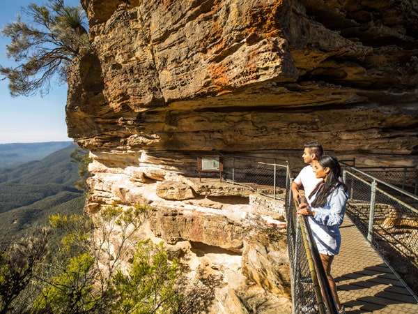 a couple overlooking the view from Honeymoon Bridge