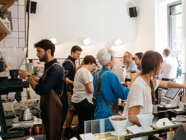 baristas busy preparing coffee and taking orders from customers at Patricia Coffee Roasters, Melbourne CBD