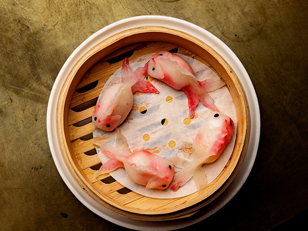 dumplings fashioned into fish at Pearl Dining in Sydney ... pictured in a bamboo basket
