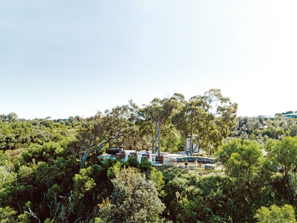 an aerial view of three girls dipping in Metung Hot Springs