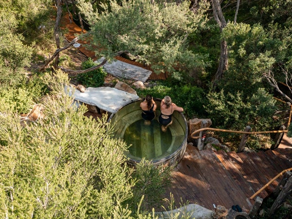 two women dipping in one of the pools at Peninsula Hot Springs