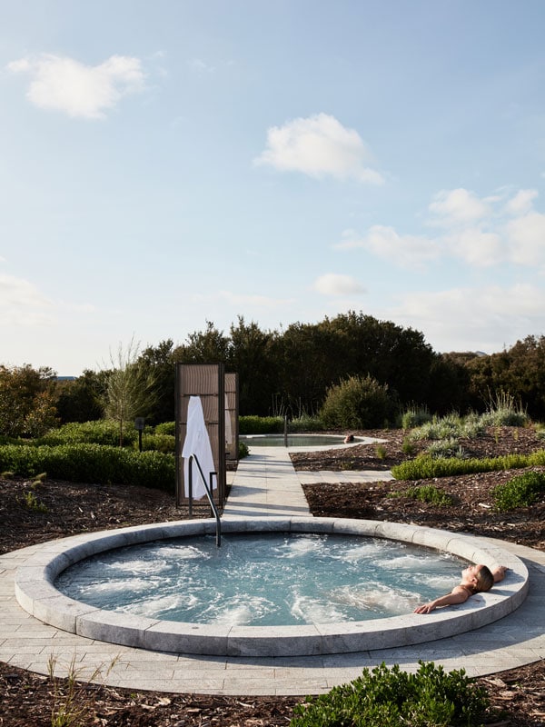 a man dipping in a thermal pool at Alba Thermal Springs & Spa