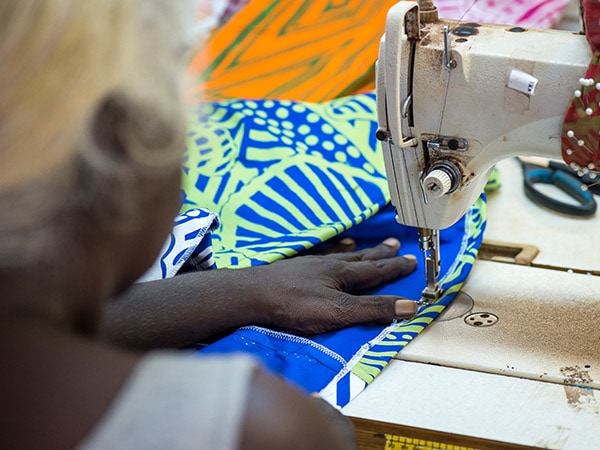 woman on Tiwi Islands sewing handmade fabrics