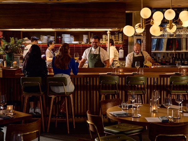 a dimly lit dining setup at Farmer’s Daughters, CBD