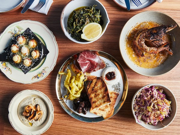 a table-top view of Greek dishes at The Good Room, Highett