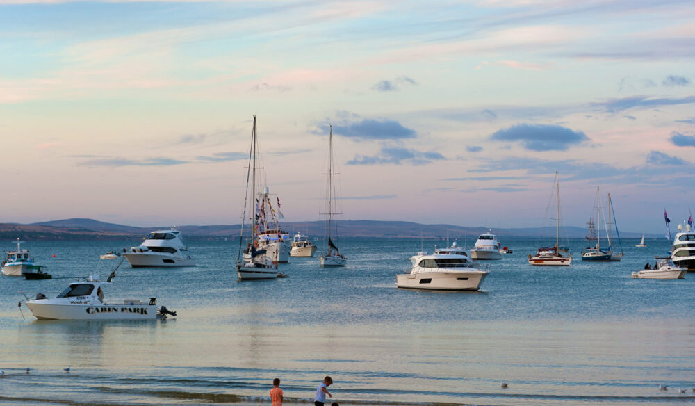 Boats and children on beach at Port Lincoln