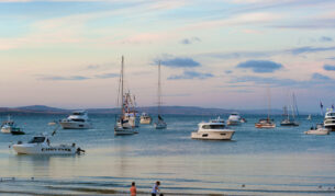 Boats and children on beach at Port Lincoln