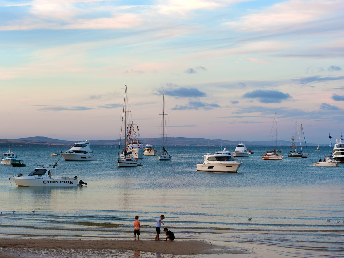 Boats and children on beach at Port Lincoln