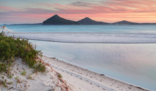 Windy sunset from Winda Woppa Reserve, overlooking Wind Woppa Lagoon and views to Mt Tomaree, Stephens Peak and Shoal Bay.