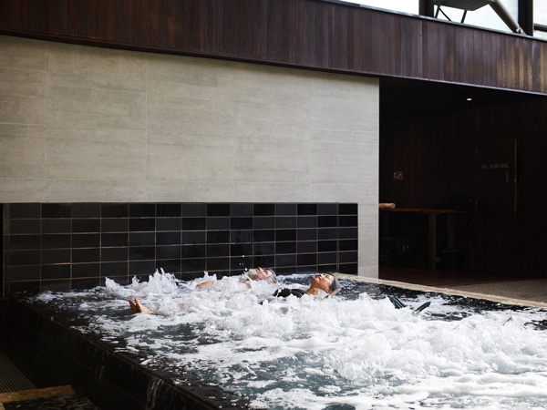 a couple enjoying a relaxing dip at Hepburn Bathhouse