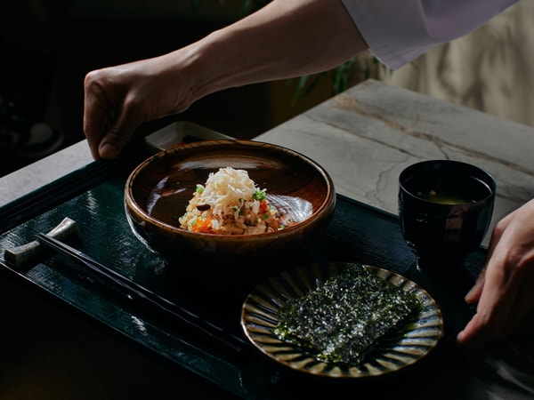 a chef serving a meal at Matsu, Footscray