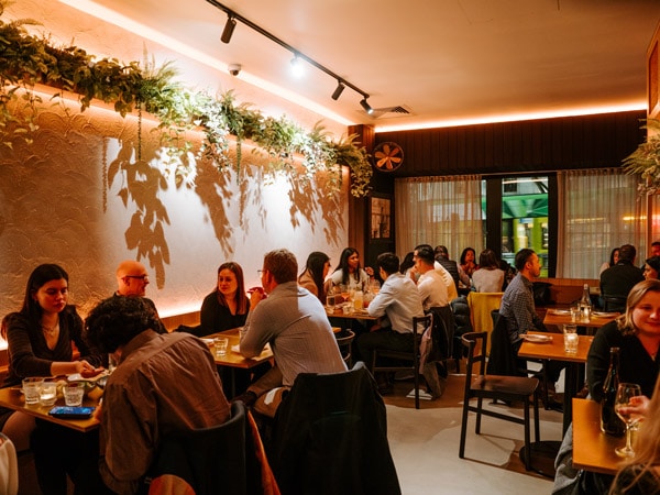 people dining inside Thai Tide, CBD