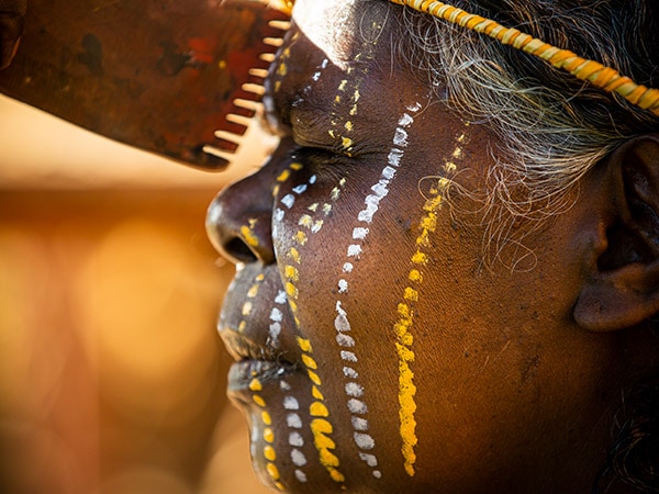 woman with traditional Indigenous face paint AAT Kings Tiwi Islands