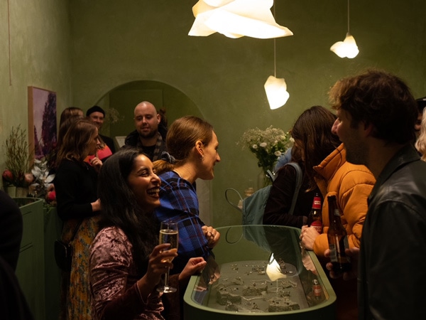 People gathering at Comune Gallery on High Street, Melbourne
