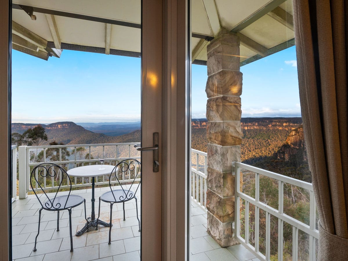 the corner view suite balcony overlooking the Blue Mountains