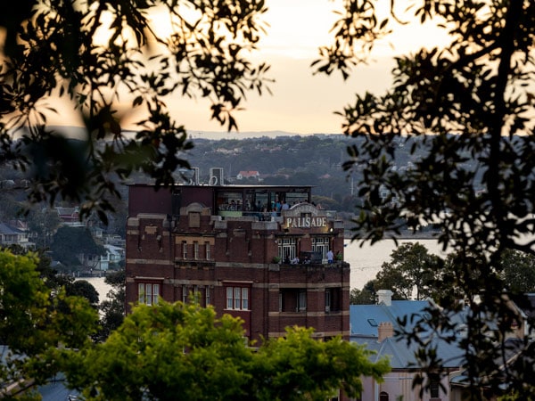 the view of the Hotel Palisade's rooftop bar from Observatory Hill, Millers Point
