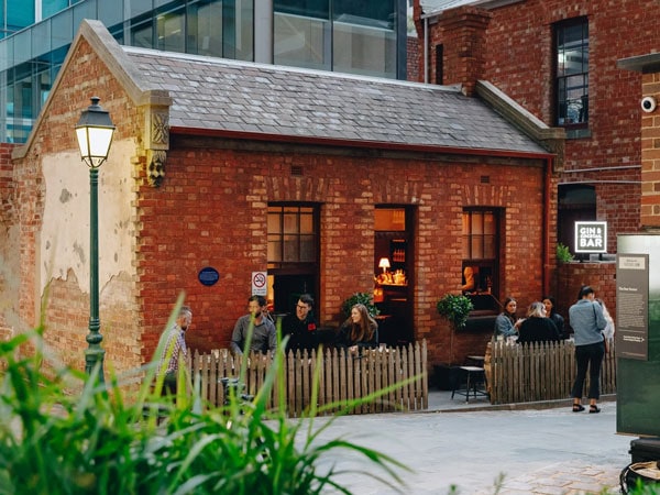 Patrons sit outside at Little Lon Distillery in Melbourne