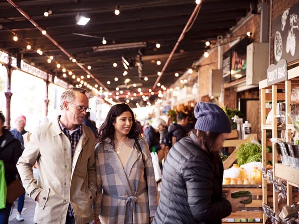 Couple browsing South Melbourne Markets