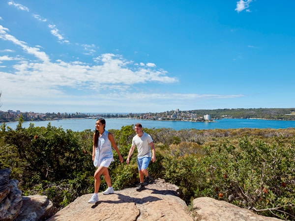 a couple walking an enjoying coastal views of SydneyHarbour from Dobroyd Head, Balgowlah Heights