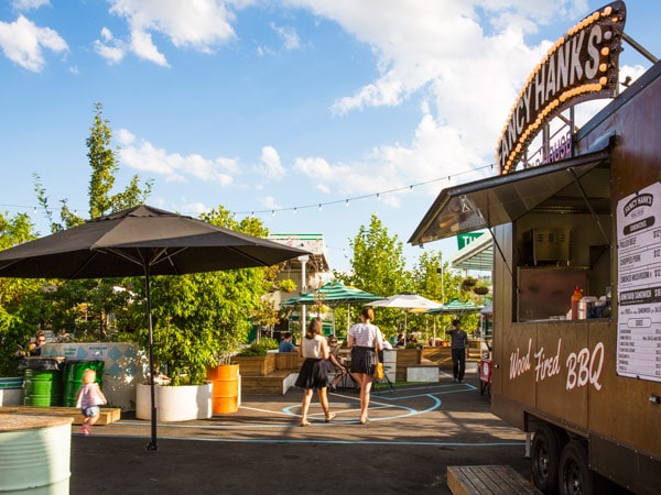 Market goers at Welcome to Thornbury food truck park in Melbourne