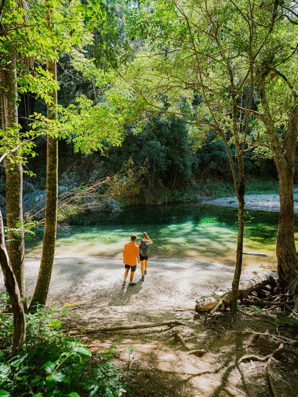 two people walking by the Booloumba Creek Falls