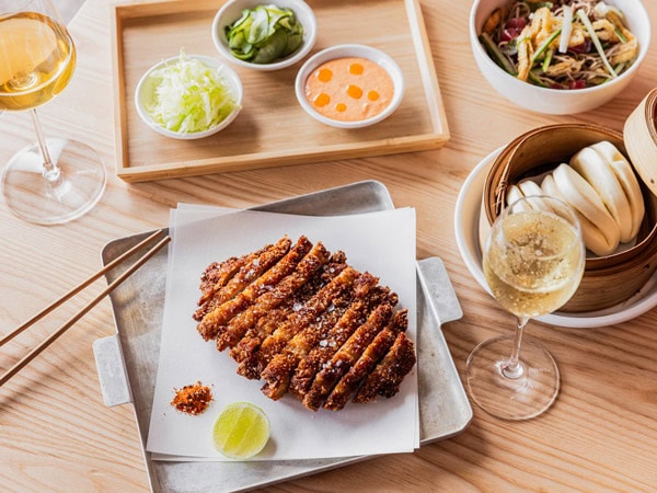 a spread of Japanese dishes on the table at Buns And Bubbles, Brisbane