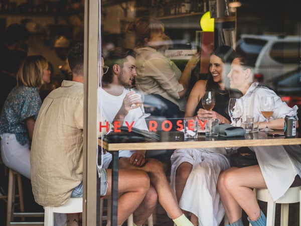 a group gathers for drinks at Hey Rosey in Orange