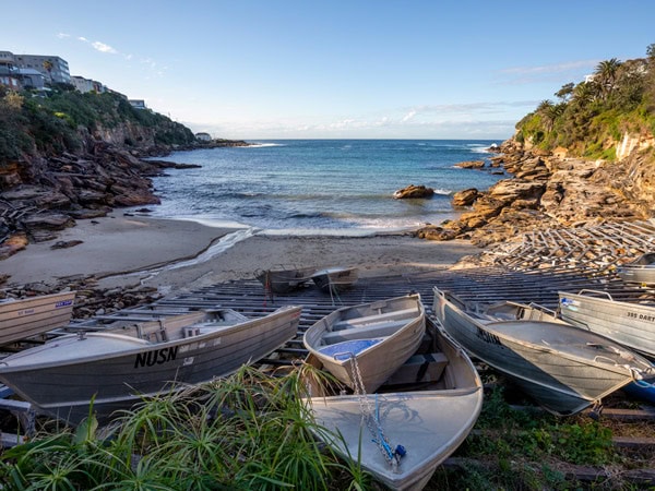 racks of small boats at Gordons Bay, Coogee