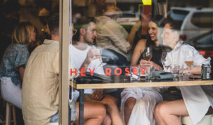 A group gathers for drinks at Hey Rosey in Orange