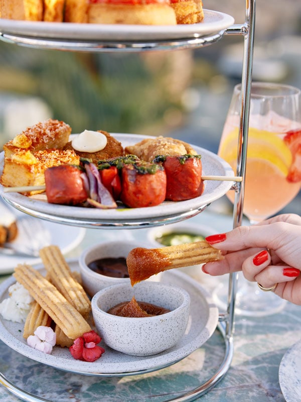 a close-up of food on a high tea tray at Hotel X, Fortitude Valley