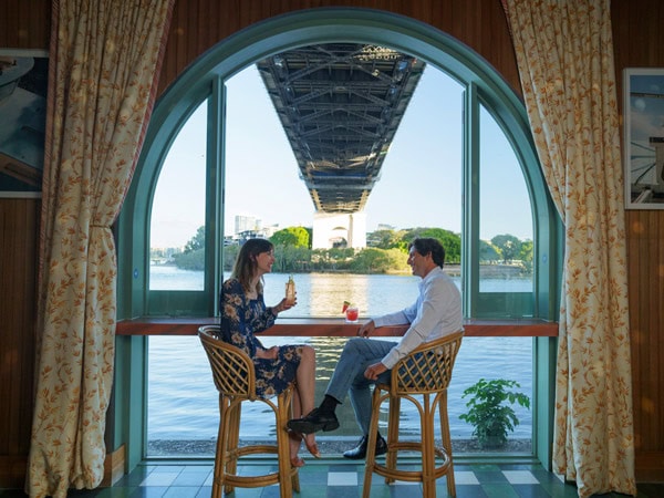 a couple dining in one of the restaurants at Howard Smith Wharves