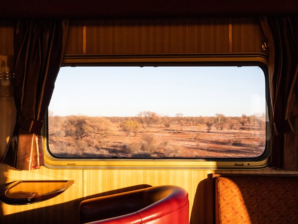 the view of the vast plains from the train window onboard The Ghan