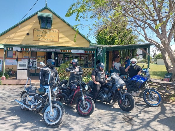 motorbike riders posing for a photo in front of Lowanna General Store