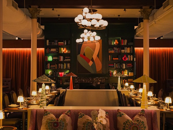 the dimly lit dining interior of The Brasserie at Naldham House